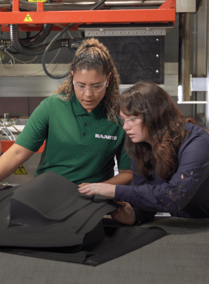 Haartz employees inspecting IP vacuum formed prototype