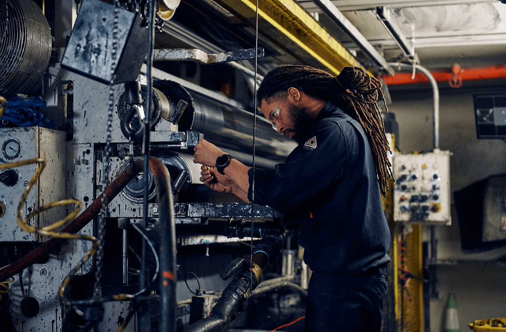 Engineering working on machine