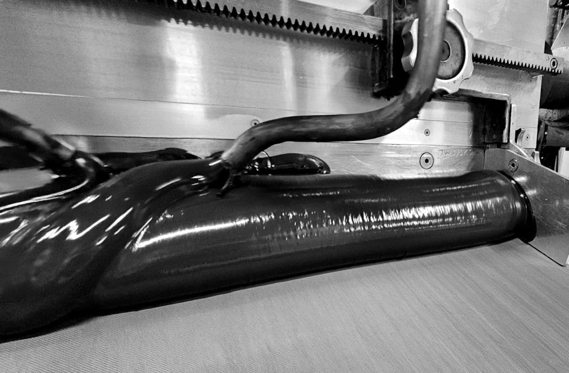 close up machine spreading coating