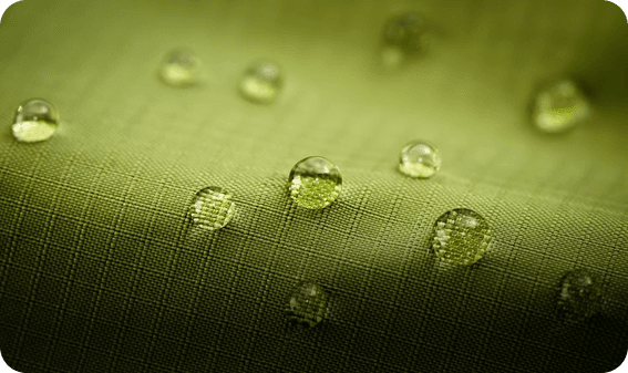 Green fabric with water droplets on it