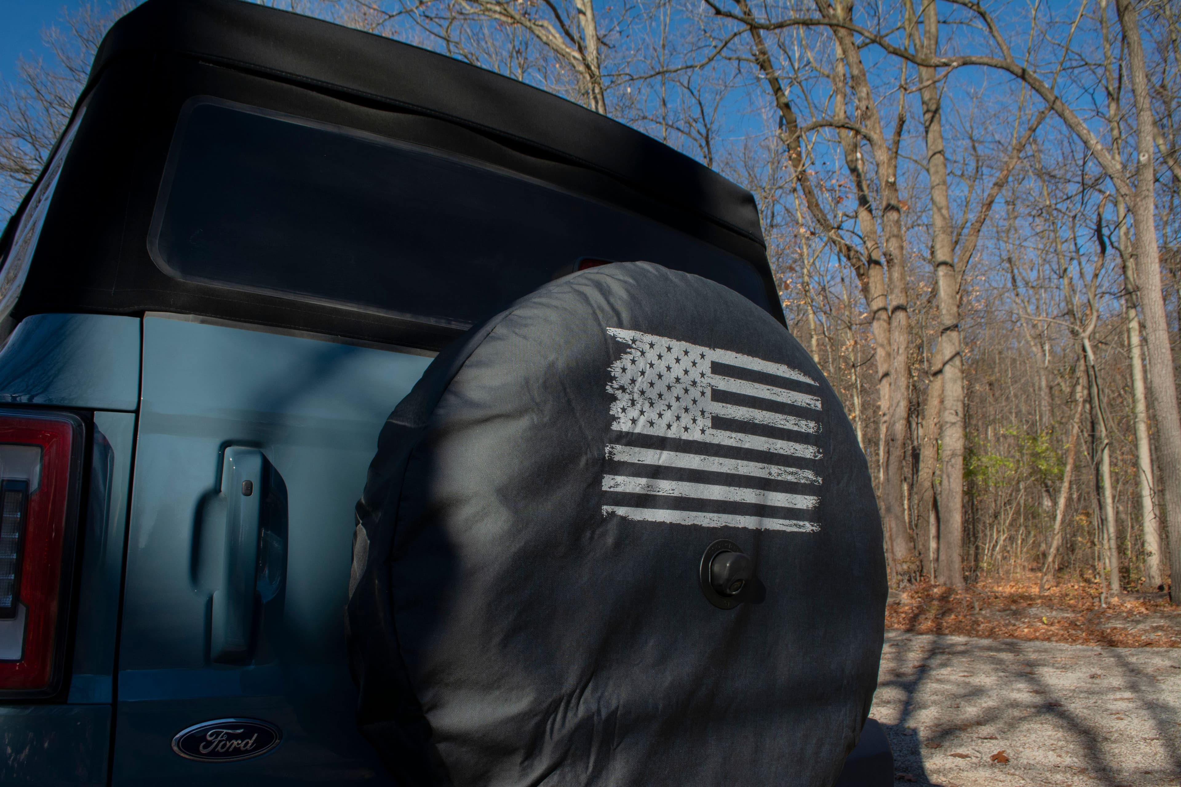 Ford blue bronco with tire cover
